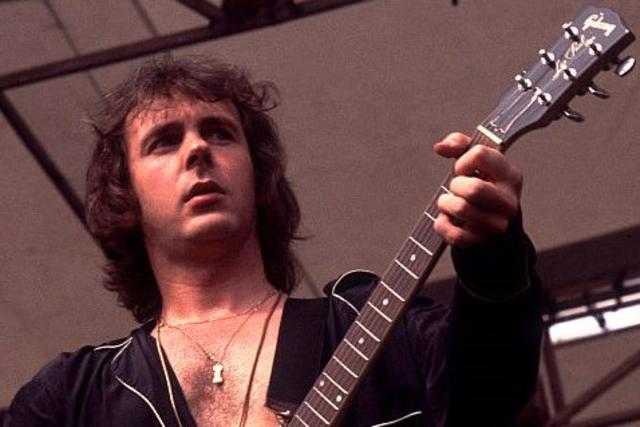 American-based rock band Foreigner performs onstage at Comiskey Park, Chicago, Illinois, August 5, 1978. Pictured is Ian McDonald on guitar. (Photo by Paul Natkin/Getty Images)
