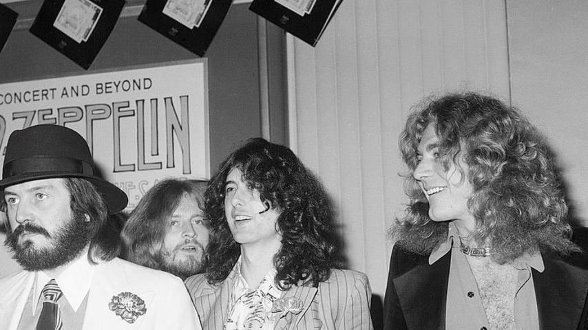 British popular musicians (left to right), drummer John Bonham (1947 - 1980), bassist and keyboardist John Paul Jones, guitarist Jimmy Page, and singer Robert Plant of the rock group Led Zeppelin appear at the West Coast premiere for their concert film 'The Song Remains the Same,' Hollywood, October 21, 1976. The film premiered in New York the night before. (Photo by Frank Edwards/Fotos international/Getty Images)